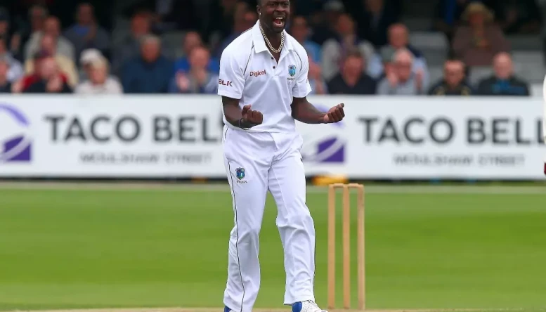 Kemar Roach celebrates after taking a wicket on Day 3