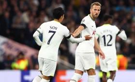 Harry Kane scored and missed a penalty as Tottenham edged past ten-man Eintracht Frankfurt with a 3-2 win in the Champions League