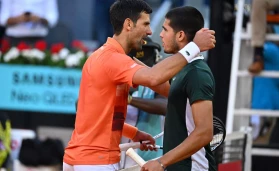 Carlos Alcaraz and Novak Djokovic during semi final match at the Mutua Madrid