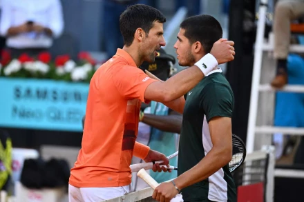 Carlos Alcaraz and Novak Djokovic during semi final match at the Mutua Madrid