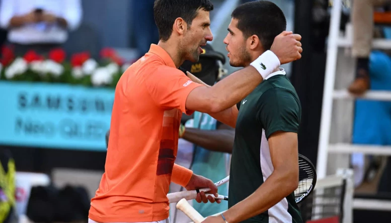 Carlos Alcaraz and Novak Djokovic during semi final match at the Mutua Madrid