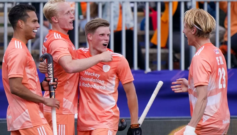 Tjep Hoedemakers of the Netherlands celebrates with Koen Bijen of the Netherlands and Jip Janssen of the Netherlands after scoring his sides fifth goal during the FIH Pro League match between