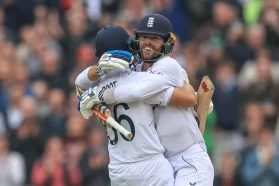 Joe Root of England and Ben Foakes of England celebrate England's test win over New Zealand