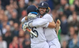 Joe Root of England and Ben Foakes of England celebrate England's test win over New Zealand