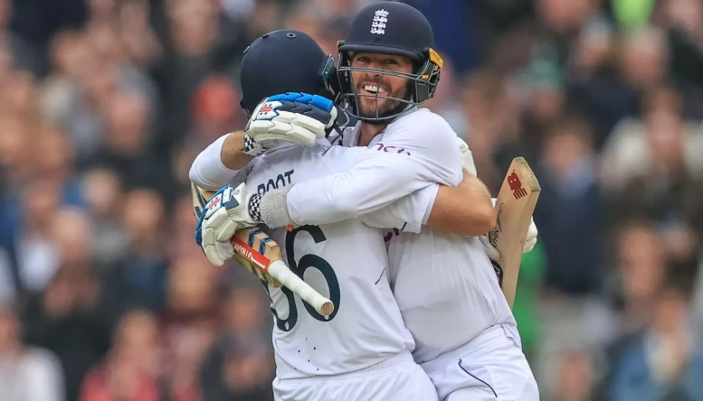 Joe Root of England and Ben Foakes of England celebrate England's test win over New Zealand