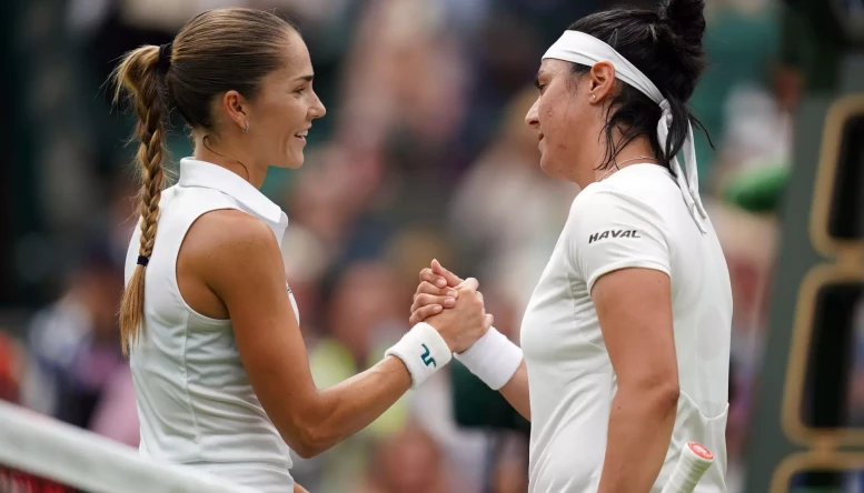 Ons Jabeur celebrates victory over Mirjam Bjorklund (left) on day one of the 2022 Wimbledon Championships at the All England Lawn Tennis and Croquet Club, Wimbledon.