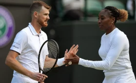 Jamie Murray and Venus Williams celebrate a point in their mixed doubles match against Alicja Rosolska and Michael Venus during day five of the 2022 Wimbledon Championships