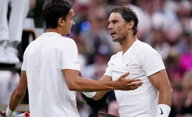 Rafael Nadal (right) and Lorenzo Sonego speak after their Gentlemen's Singles third round match