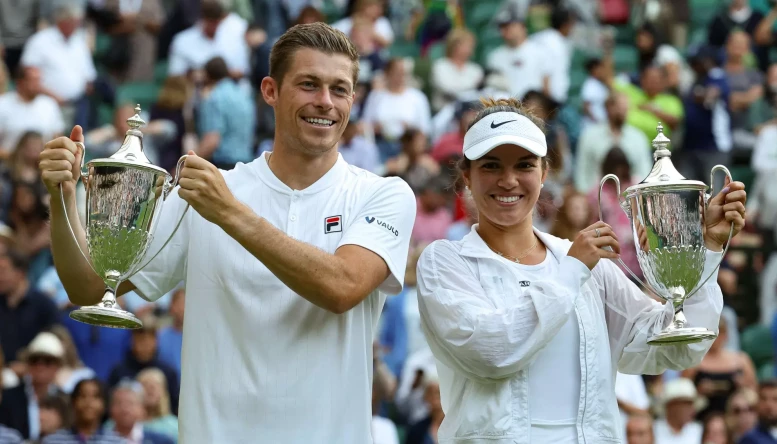 Wimbledon Tennis tournament; Neal Skupski (GBR) and Desirae Krawczyk (USA) lift the Mixed Doubles Trophy after defeating Samantha Stosur (AUS) and Matthew Ebden (AUS) in two sets