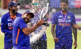 India's Rohit Sharma with the trophy after his side won the series 2-1 against England following the third one day international match at the Emirates Old Trafford, Manchester