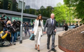 Former German tennis star BORIS BECKER with his partner LILIAN DE CARVALHO MONTEIRO arrives at Southwark Crown Court in London for sentencing.