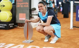 Ons Jabeur of Tunisia poses with the champion trophy after winning against Jessica Pegula of United States, Women's Final during the Mutua Madrid Open 2022 tennis tournament
