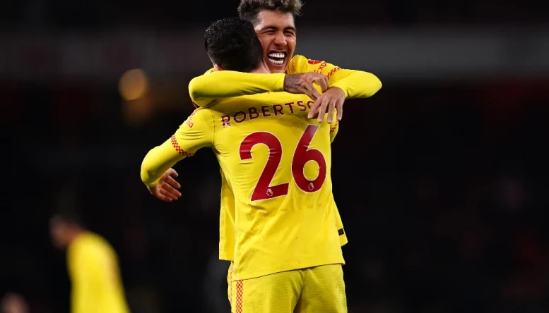 Firmino and Robertson celebrate after full time