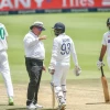 jasprit_bumrah_with_umpire_erusmus_in_a_recent_test_match.png