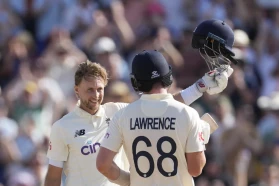 Joe Root celebrates his century against the Windies