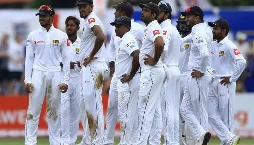 The Sri Lankan team watch as a decision is reviewed