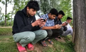 Indian boys playing mobile games