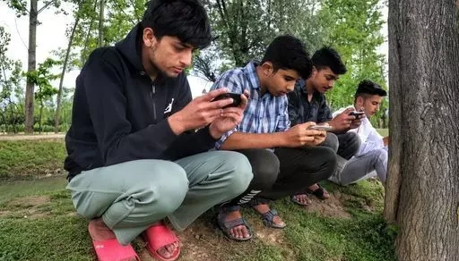 Indian boys playing mobile games