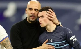 Pep Guardiola and Phil Foden.