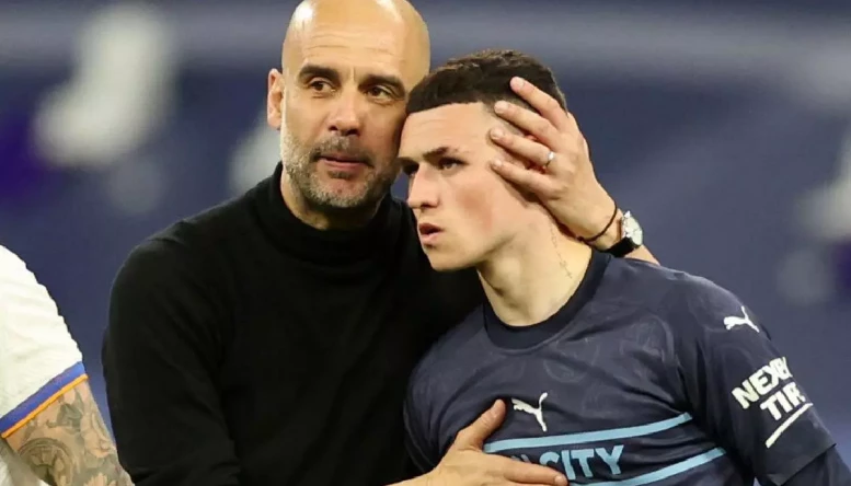 Pep Guardiola and Phil Foden.