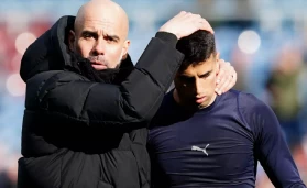 Pep Guardiola and Joao Cancelo.